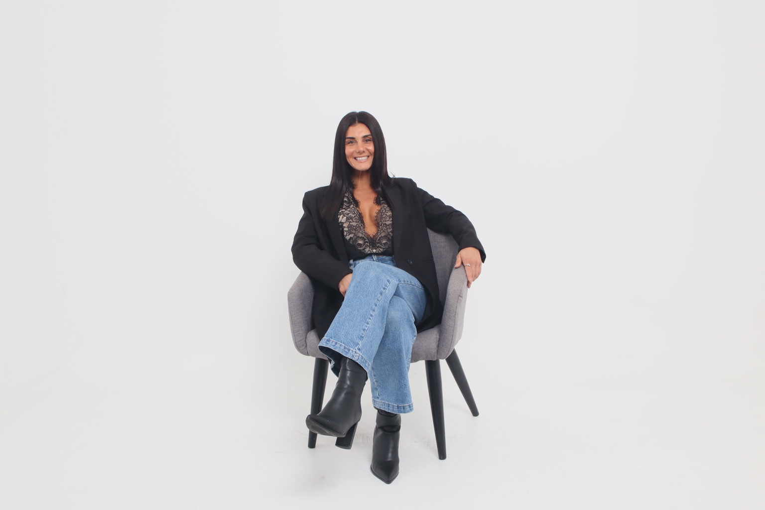 Emily, founder of Emaura Elements, seated portrait
